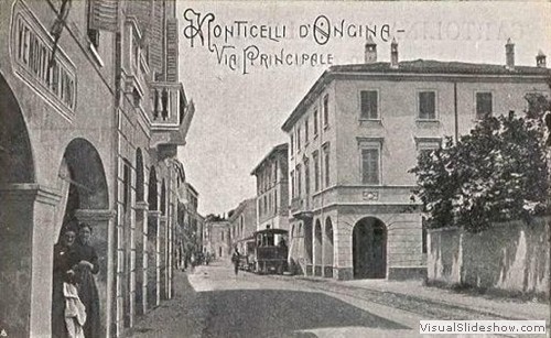 monticelli d'ongina, la via principale con il tram a vapore anni 30
